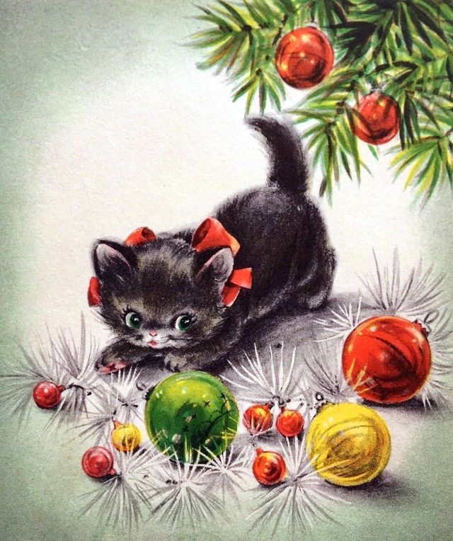 Precious kitten playing with Christmas tree ornaments. Not a good idea. Provide cat toys for your cats. Cats and Holidays
